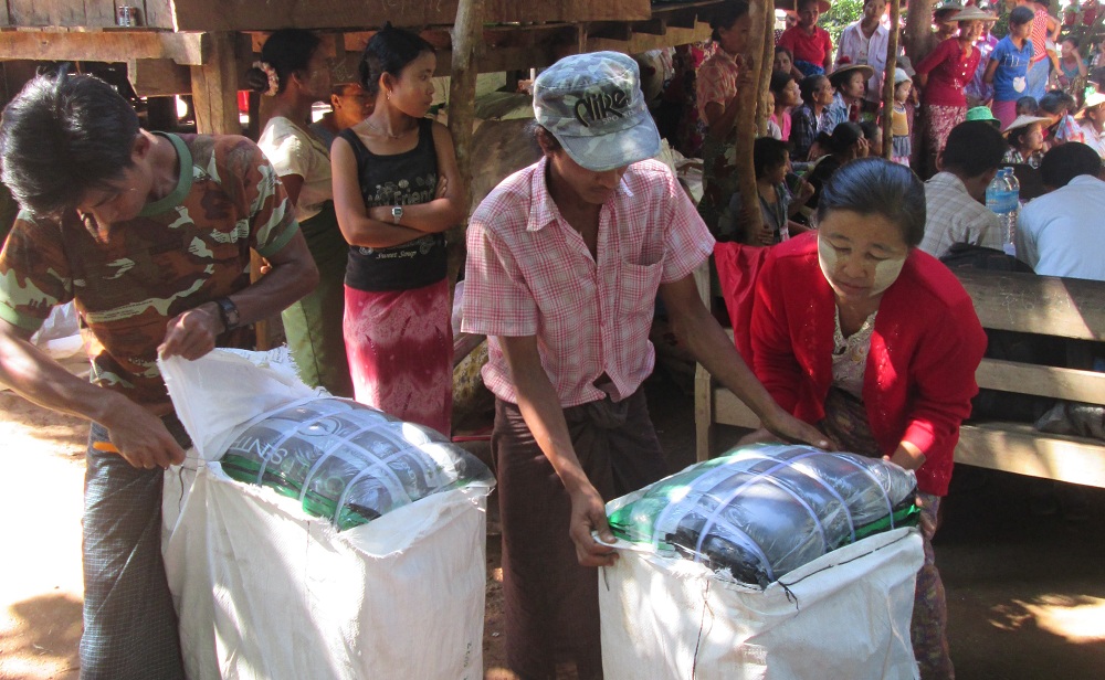 PHOTO- Beneficiaries from Kyauk Maw village of Shwe Kyin Township, Bago region prepare for distribution of LLIN to villagers (credit- Burnet Institute, 2014)